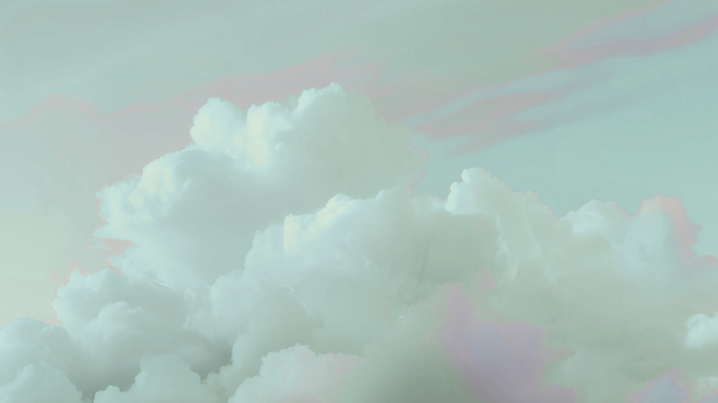 Fluffy white clouds against a soft pastel sky.